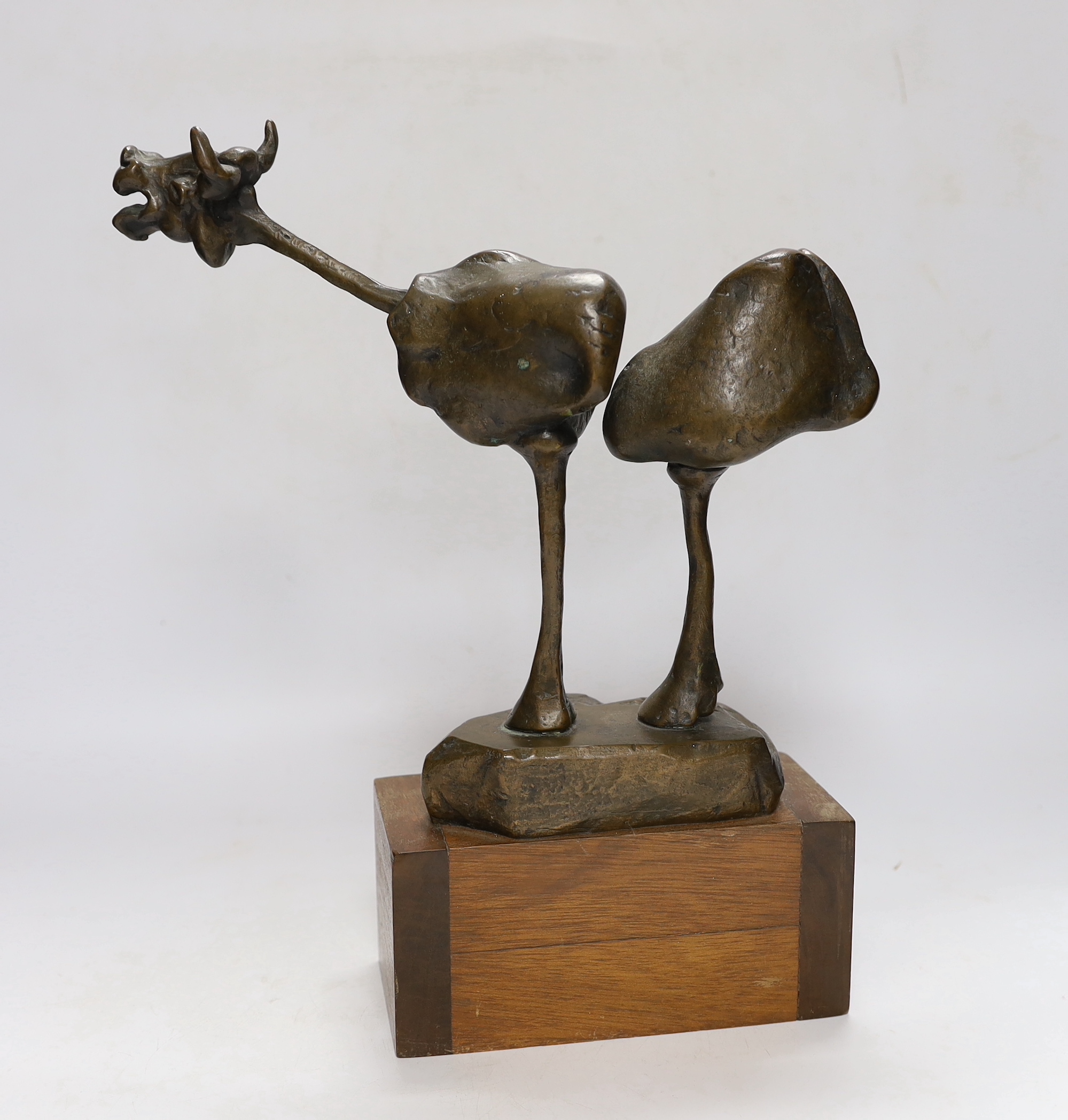 An abstract bronze model of a cow, 34cm